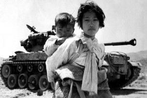 Girl with brother during Korean War