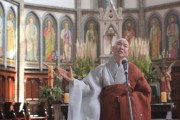 Buddhist performs in cathedral